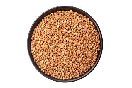 Green buckwheat grain in clay bowl isolated on white background, top view. File contains clipping path. Full depth of field.の写真素材