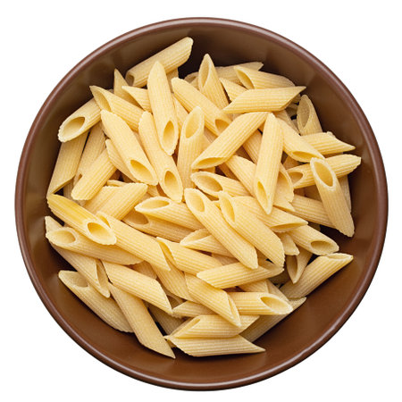 Pennette rigate. Raw pasta in a plate isolated on white background. Top view. File contains clipping path.の写真素材