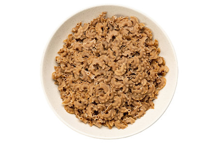 Raw paste in a bowl isolated on white background, Italian food. Close-up view from the top. File contains clipping path.の写真素材