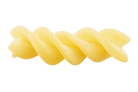 Pasta fusilli extreme close up isolated on white background. Italian Culture. File contains clipping path. Top view.の写真素材