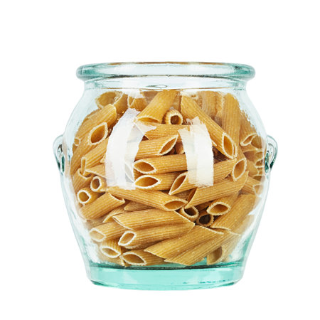 Whole Grain penne pasta from durum wheat in jar isolated on white background. Healthy eating concept. Penne Rigate. File contains clipping path.の写真素材