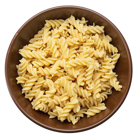 Raw pasta Fusilli in  bowl isolated on white background. Raw and Dry Macaroni. Italian Culture. File contains clipping path.の写真素材