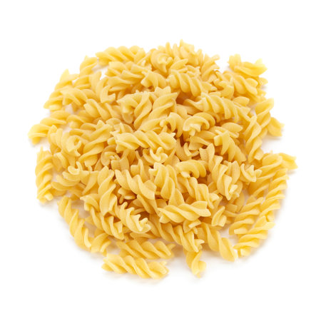 Raw pasta Fusilli isolated on white background. Raw and Dry Macaroni. Italian Culture. Top view.の写真素材