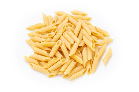 Pennette rigate. Raw pasta on white background. Top view. File contains clipping path.の写真素材