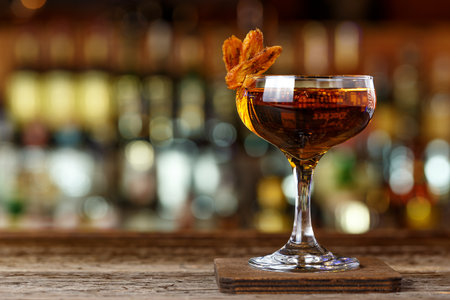 Strong cocktail on the bar. A brown cocktail based on whiskey and sherry.の写真素材