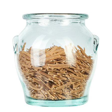 Glass jar filled raw pasta isolated on white background. File contains clipping path.の写真素材