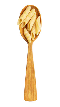 Pennette rigate. Raw pasta in wood spoon isolated on white background. Top view. File contains clipping path.の写真素材