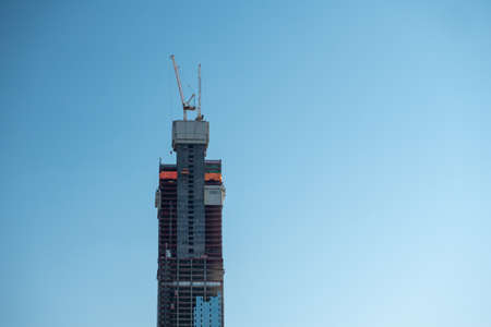 Nur-Sultan, Kazakhstan - July 15, 2019: construction of the building of Abu Dhabi Plaza - the tallest skyscraper in Central Asia. The building on a background of clear skyのeditorial素材