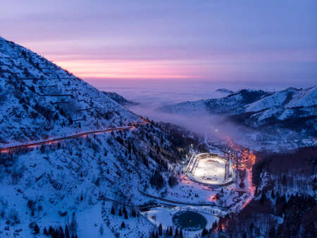 ALMATY, KAZAKHSTAN - FEBRUARY 19, 2020: View of the Medeo ice rink late at night. Winter in the mountains of Zailiysky Alatau. Small Almaty Gorge. Late evening in the mountainsのeditorial素材