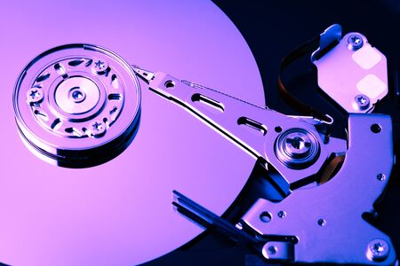 An open computer hard drive for repair. HDD. Components for ps. Storage and restoration of digital...