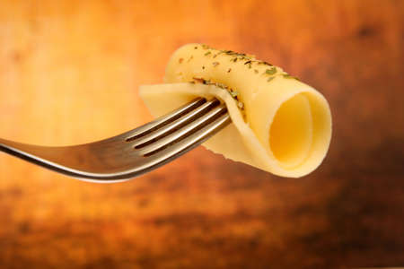Roll of thin cheese pieceの写真素材