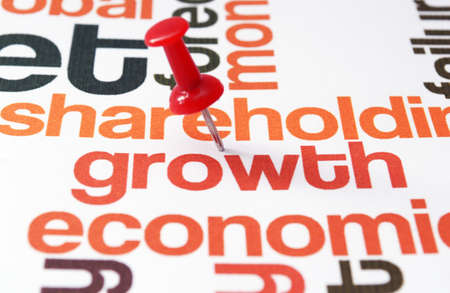 Push pin on growth textの写真素材