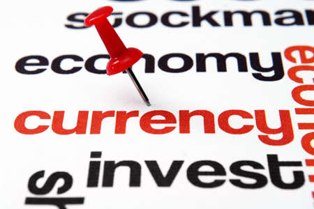 Push pin on currencyの写真素材