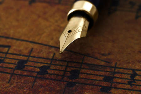 Fountain pen on music sheetの写真素材