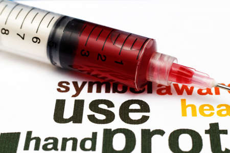 Syringe on health backgroundの写真素材