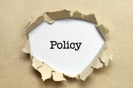 Policy text on paper holeの写真素材