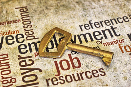 Golden key on job textの写真素材
