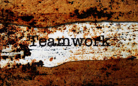 Teamwork on torn paperの写真素材