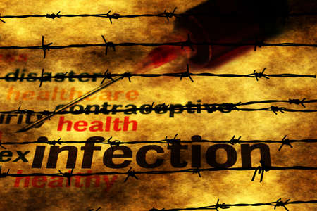 Syringe and infection concept against barbwireの写真素材
