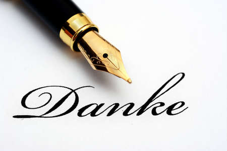 Fountain pen on danke text - A word of Germanic origin, meaning thanks/thank you;の写真素材