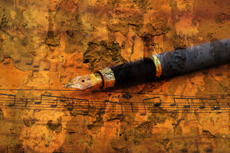 Fountain pen on music sheetの写真素材
