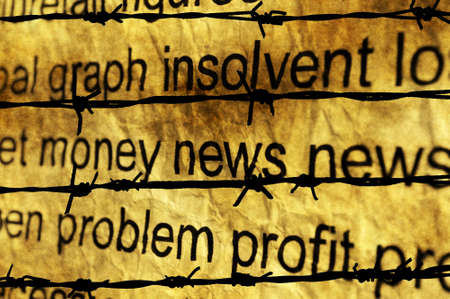 Money and news concept against barbwireの写真素材