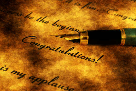 Fountain pen on congratulation textの写真素材