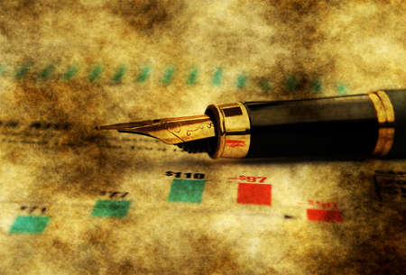 Fountain pen on financial reportの写真素材