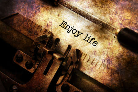Enjoy life text on vintage typewriterの写真素材