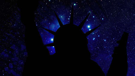 The statue of liberty of New York City against stars at nightの写真素材