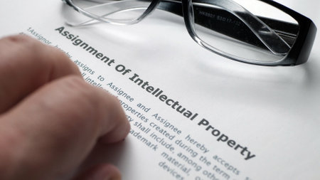 Finger tapping on intellectual property formの写真素材