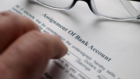Finger tapping on assignment of bank accountの写真素材