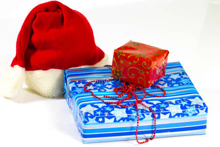 A pile of colorful Christmas gifts isolated on white backgroundの写真素材