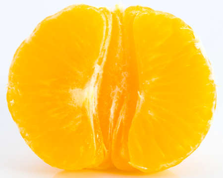 Slices of juicy tangerine isolated on white backgroundの写真素材
