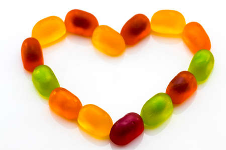 colorful fruit jelly candies isolated on white. Loveの写真素材