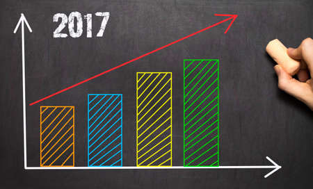 Hand drawing growth graph for business on blackboardの写真素材