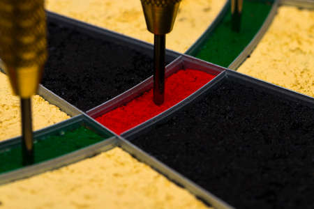 Success hitting target aim goal achievement concept background - darts in bull's eye close upの写真素材