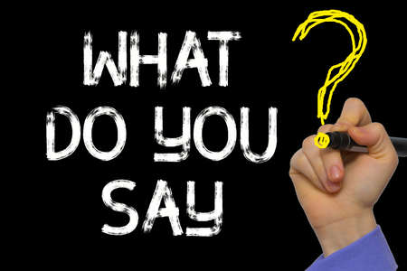 Hand writing the text: What Do You Say?の写真素材