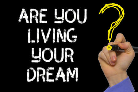 Hand writing the text: Are You Living Your Dream?の写真素材