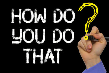 Hand writing the text: How Do You Do That?の写真素材