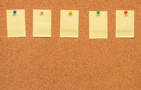 Yellow blank note on Cork board with clipping path.の写真素材