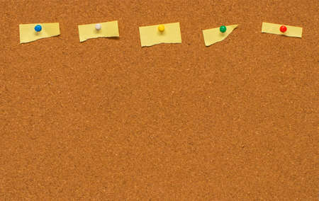 Yellow blank note on Cork board with clipping path.の写真素材