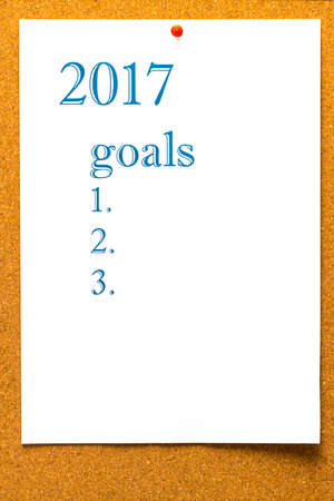 2017 GOALS  - teared note paper pinned on bulletin boardの写真素材