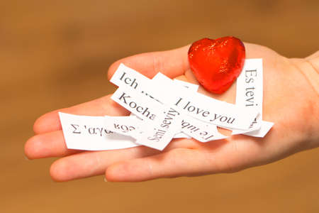 I Love You. The words, printed on papers in different languages on your palmの写真素材