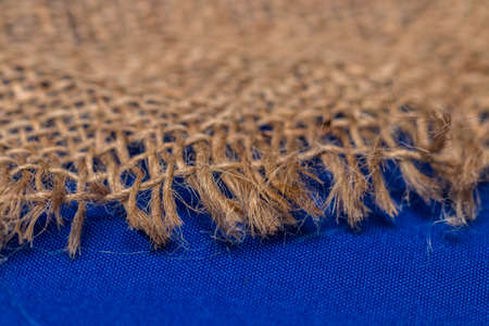  burlap on a blue fabric texture for background.の写真素材