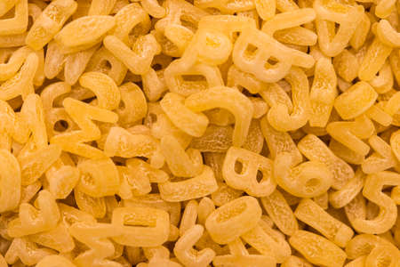 Frame full of alphabet noodles or alphabet pasta.の写真素材