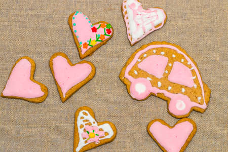 baby cookie on burlap in a heart shape.の写真素材
