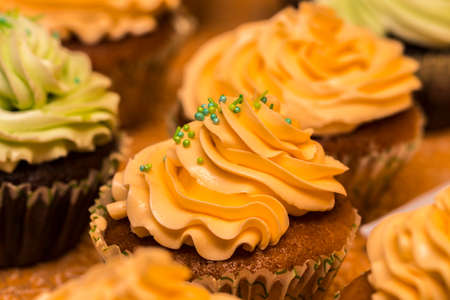 Chocolate cupcakes with mint on wooden table.の写真素材