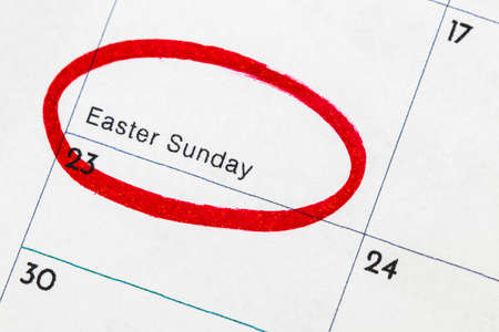 "Easter" is the text written on the calendar, circled in red marker.の写真素材