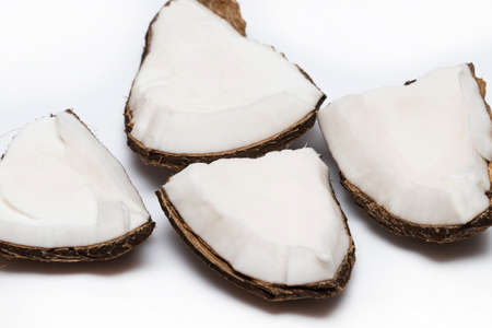 Coconut pieces isolated on a white background.
